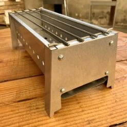 Spiedini Saté-bbq Bali 40 Mini - Kleine, Smalle Houtskoolbarbecue Met Horizontaal Rooster Voor Sate Of Andere Spiesjes - 40 Cm Lang, 11 Cm Breed, 14 Cm Hoog - Ideaal Voor Tuin- Of Open Haard, Of Balkon - Materiaal: Gealuminiseerd Ijzer 12 Spiedini Saté-bbq Bali 40 Mini - Kleine, Smalle Houtskoolbarbecue Met Horizontaal Rooster Voor Sate Of Andere Spiesjes - 40 Cm Lang, 11 Cm Breed, 14 Cm Hoog - Ideaal Voor Tuin- Of Open Haard, Of Balkon - Materiaal: Gealuminiseerd Ijzer -Babyproducten 1200x1200 901